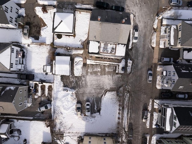 snowy aerial view with a residential view