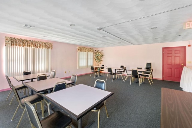 view of carpeted dining space