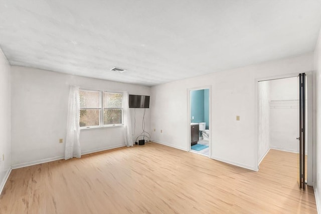 spare room with light wood-type flooring