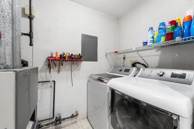 washroom with independent washer and dryer and electric panel