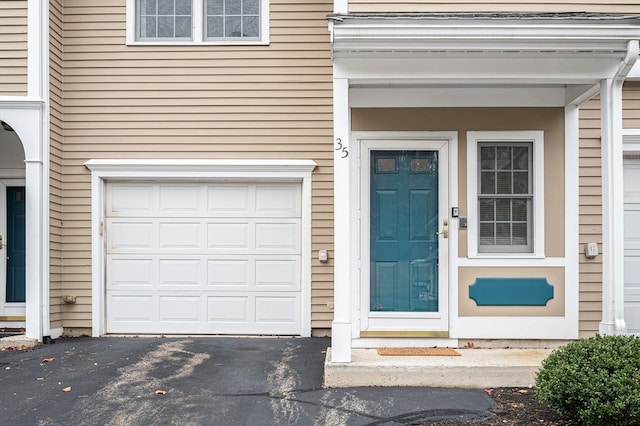 entrance to property featuring a garage