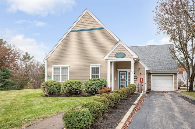 view of front of property with a garage and a front yard