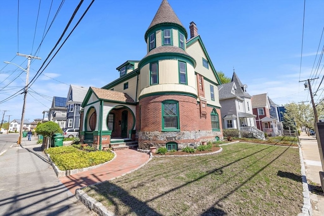 124 Boston Ave, Medford, MA 02155 - view of front of property featuring a residential view, a chimney, a front yard, and brick siding