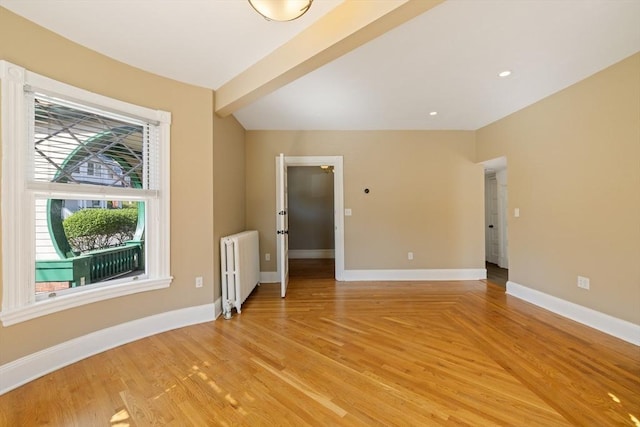 124 Boston Ave, Medford, MA 02155 - empty room featuring radiator heating unit, baseboards, and light wood-style flooring