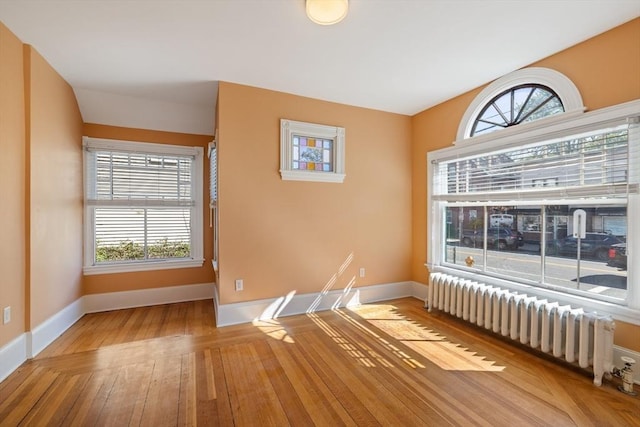 124 Boston Ave, Medford, MA 02155 - unfurnished room with radiator, baseboards, and healthy amount of natural light