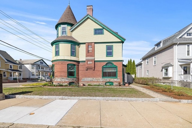 124 Boston Ave, Medford, MA 02155 - victorian house with brick siding, a chimney, a front lawn, and a residential view