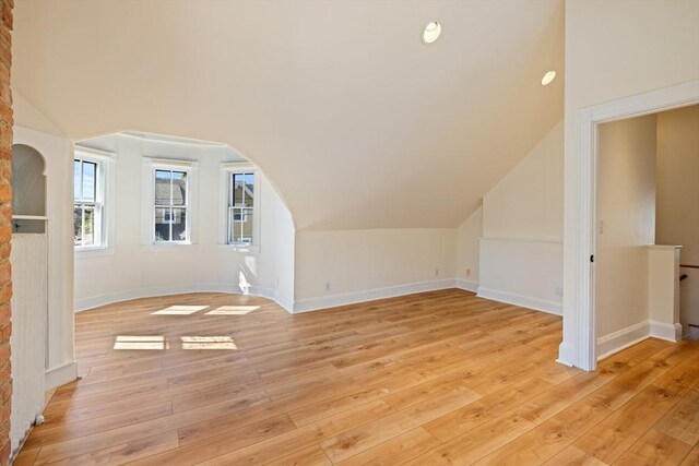 124 Boston Ave, Medford, MA 02155 - additional living space featuring light wood finished floors, baseboards, and lofted ceiling