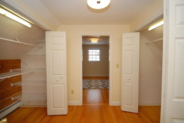 interior space featuring light wood-type flooring and a baseboard radiator