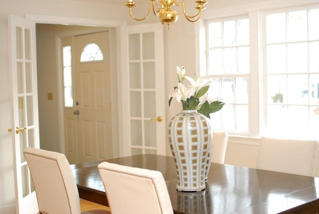 dining room featuring a notable chandelier and a wealth of natural light