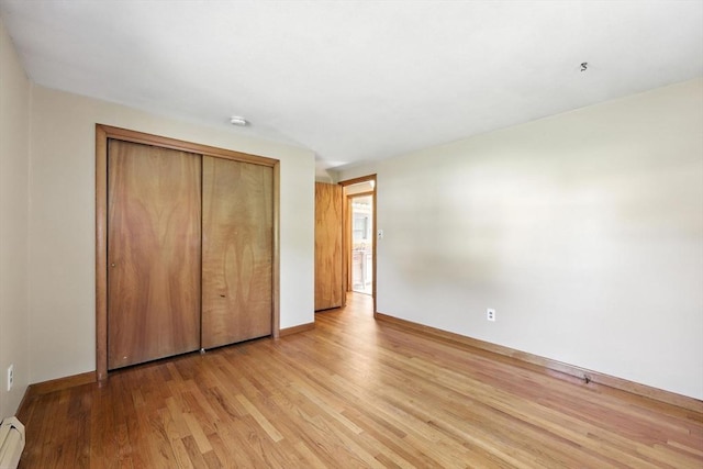 51 Glenview Dr, West Springfield, MA 01089 - unfurnished bedroom with baseboard heating, light wood finished floors, and a closet
