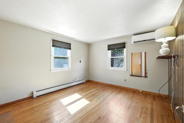 51 Glenview Dr, West Springfield, MA 01089 - unfurnished room with baseboard heating, a wall unit AC, and wood-type flooring