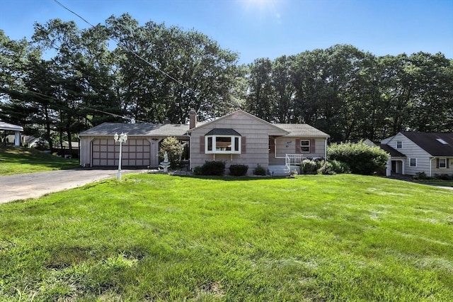 51 Glenview Dr, West Springfield, MA 01089 - view of front of house featuring an attached garage, driveway, a front yard, and a chimney