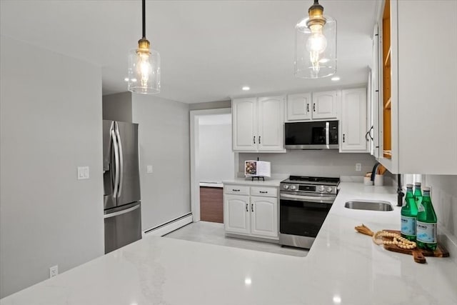 42 Stevens Ave, Braintree, MA 02184 - kitchen with stainless steel appliances, white cabinetry, decorative light fixtures, baseboard heating, and recessed lighting