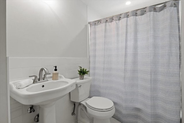 42 Stevens Ave, Braintree, MA 02184 - full bath featuring tile walls, a wainscoted wall, and a shower with curtain