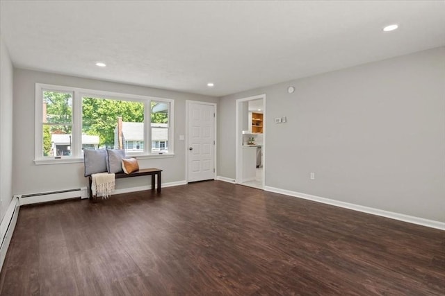 42 Stevens Ave, Braintree, MA 02184 - living area with dark wood-style floors, recessed lighting, and baseboard heating