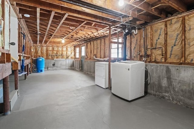 42 Stevens Ave, Braintree, MA 02184 - basement with washing machine and dryer and a water pressure tank