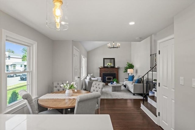 42 Stevens Ave, Braintree, MA 02184 - dining space featuring a chandelier, healthy amount of natural light, dark wood-style floors, stairs, and vaulted ceiling