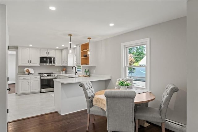 42 Stevens Ave, Braintree, MA 02184 - dining space with baseboard heating, recessed lighting, and wood finished floors
