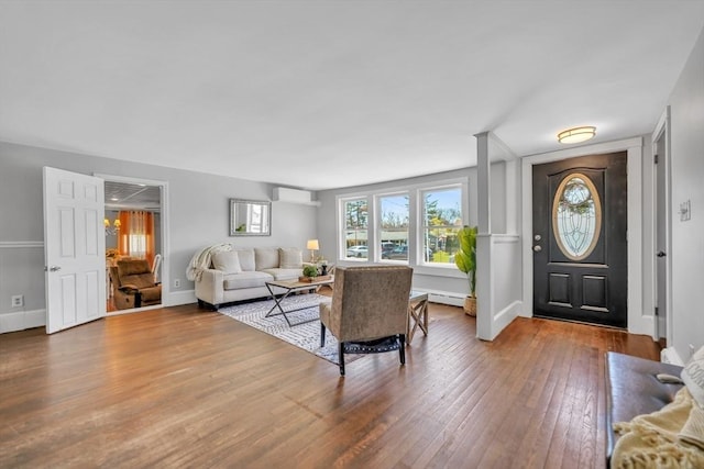 31 Darling St, Acushnet, MA 02743 - foyer entrance featuring baseboards, a baseboard radiator, an AC wall unit, and hardwood / wood-style flooring