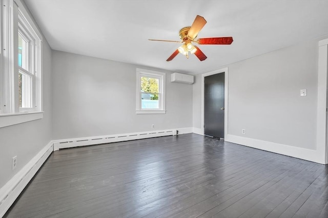 31 Darling St, Acushnet, MA 02743 - empty room featuring a ceiling fan, dark wood-type flooring, a baseboard heating unit, a wall mounted AC, and a baseboard radiator