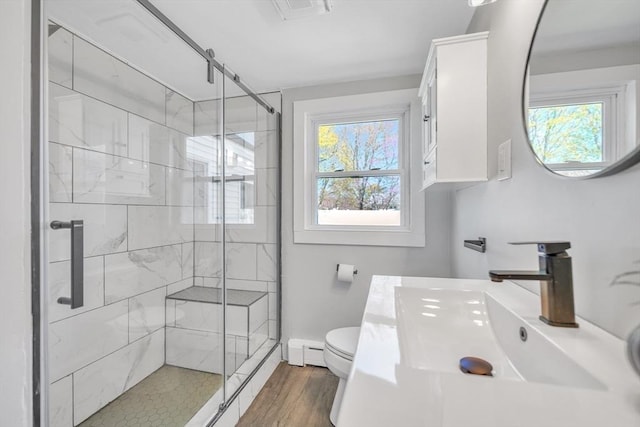 31 Darling St, Acushnet, MA 02743 - full bathroom with vanity, toilet, a baseboard heating unit, and a stall shower