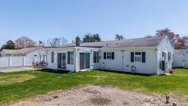 31 Darling St, Acushnet, MA 02743 - back of house featuring a lawn, a patio, fence, and a chimney