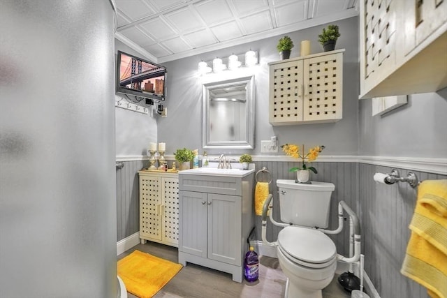 31 Darling St, Acushnet, MA 02743 - bathroom featuring crown molding, wood finished floors, a wainscoted wall, an ornate ceiling, and toilet