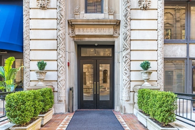 view of exterior entry featuring french doors