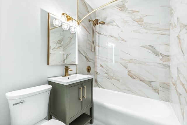 full bathroom featuring tiled shower / bath, toilet, and vanity