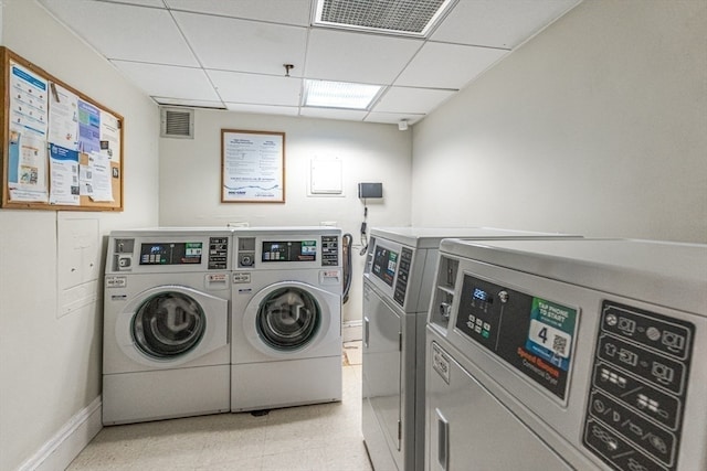 laundry area with washing machine and clothes dryer