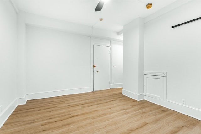 unfurnished room featuring light wood-type flooring and ceiling fan