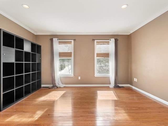 unfurnished room with ornamental molding, recessed lighting, wood finished floors, and baseboards