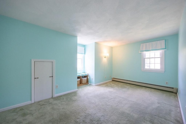 165 Roundtop Rd, Marlborough, MA 01752 - carpeted empty room with a baseboard heating unit and baseboards