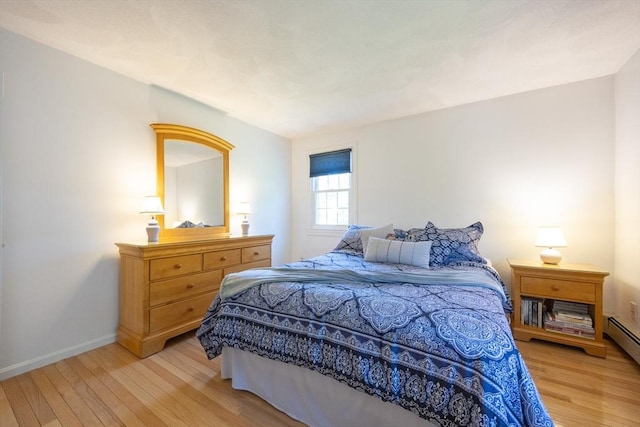 165 Roundtop Rd, Marlborough, MA 01752 - bedroom featuring light wood-style floors, baseboards, and a baseboard radiator