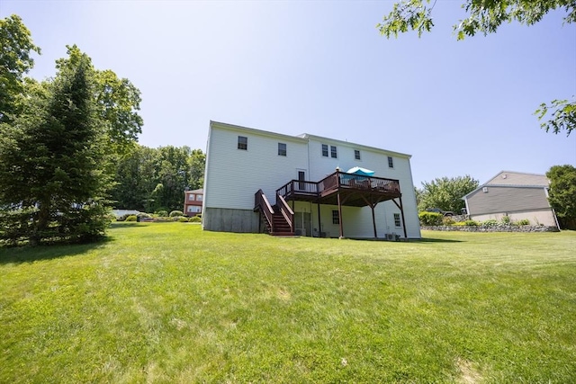 165 Roundtop Rd, Marlborough, MA 01752 - rear view of property featuring stairway, a deck, and a lawn