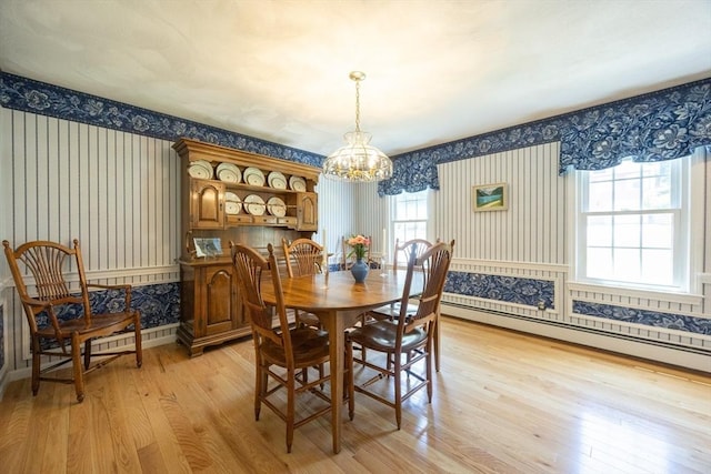 165 Roundtop Rd, Marlborough, MA 01752 - dining area with wallpapered walls, a chandelier, light wood-style floors, baseboard heating, and wainscoting