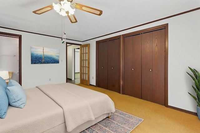 58 Daniel Shays Hwy, Pelham, MA 01007 - carpeted bedroom featuring a ceiling fan, baseboards, multiple closets, and ornamental molding