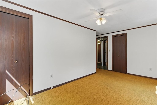 58 Daniel Shays Hwy, Pelham, MA 01007 - spare room with baseboards, ornamental molding, light carpet, and a ceiling fan