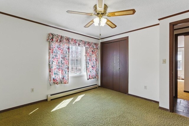58 Daniel Shays Hwy, Pelham, MA 01007 - unfurnished bedroom featuring crown molding, carpet, a baseboard heating unit, and a closet