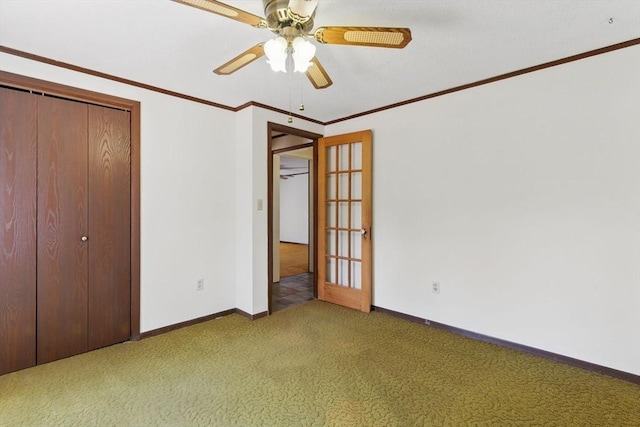 58 Daniel Shays Hwy, Pelham, MA 01007 - unfurnished bedroom featuring ceiling fan, carpet, baseboards, ornamental molding, and a closet