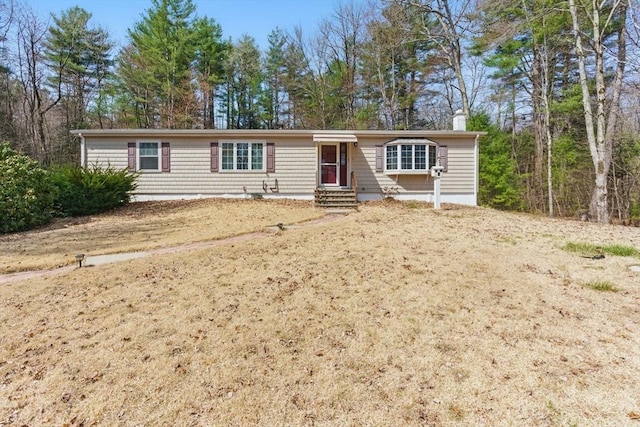 58 Daniel Shays Hwy, Pelham, MA 01007 - manufactured / mobile home featuring a chimney and entry steps