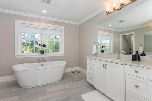 1 Clearview Dr, Franklin, MA 02038 - full bathroom with vanity, a soaking tub, baseboards, crown molding, and recessed lighting