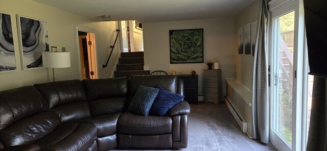 carpeted living room featuring a baseboard heating unit