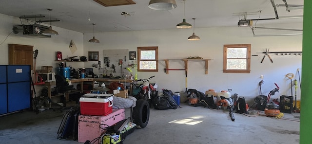 garage featuring a workshop area and a garage door opener