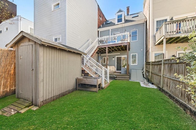 381 Bunker Hill St Unit 1, Boston, MA 02129 - back of house featuring a shed, a fenced backyard, and a wooden deck