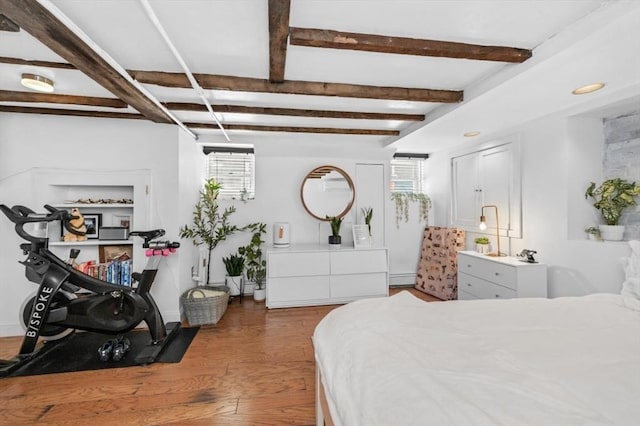 381 Bunker Hill St Unit 1, Boston, MA 02129 - bedroom with multiple windows, wood finished floors, beam ceiling, and baseboard heating