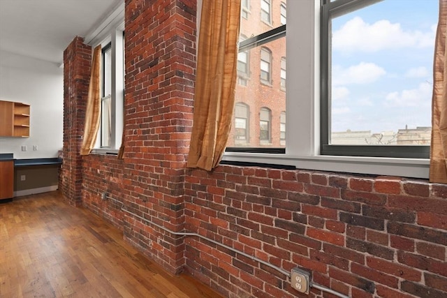 view of side of home with brick siding