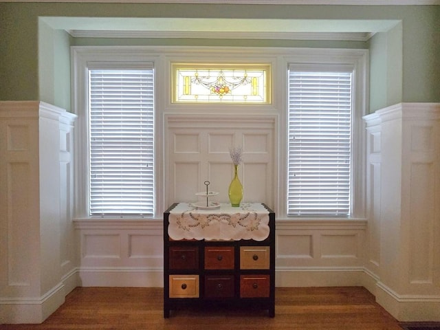 details featuring a decorative wall and wood finished floors