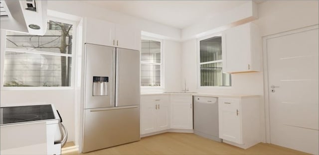 kitchen with paneled built in refrigerator, light countertops, white cabinets, and dishwasher