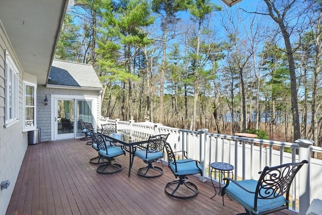 wooden deck with outdoor dining space